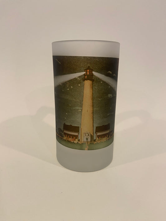 Cylindrical product with a lighthouse design on a white background