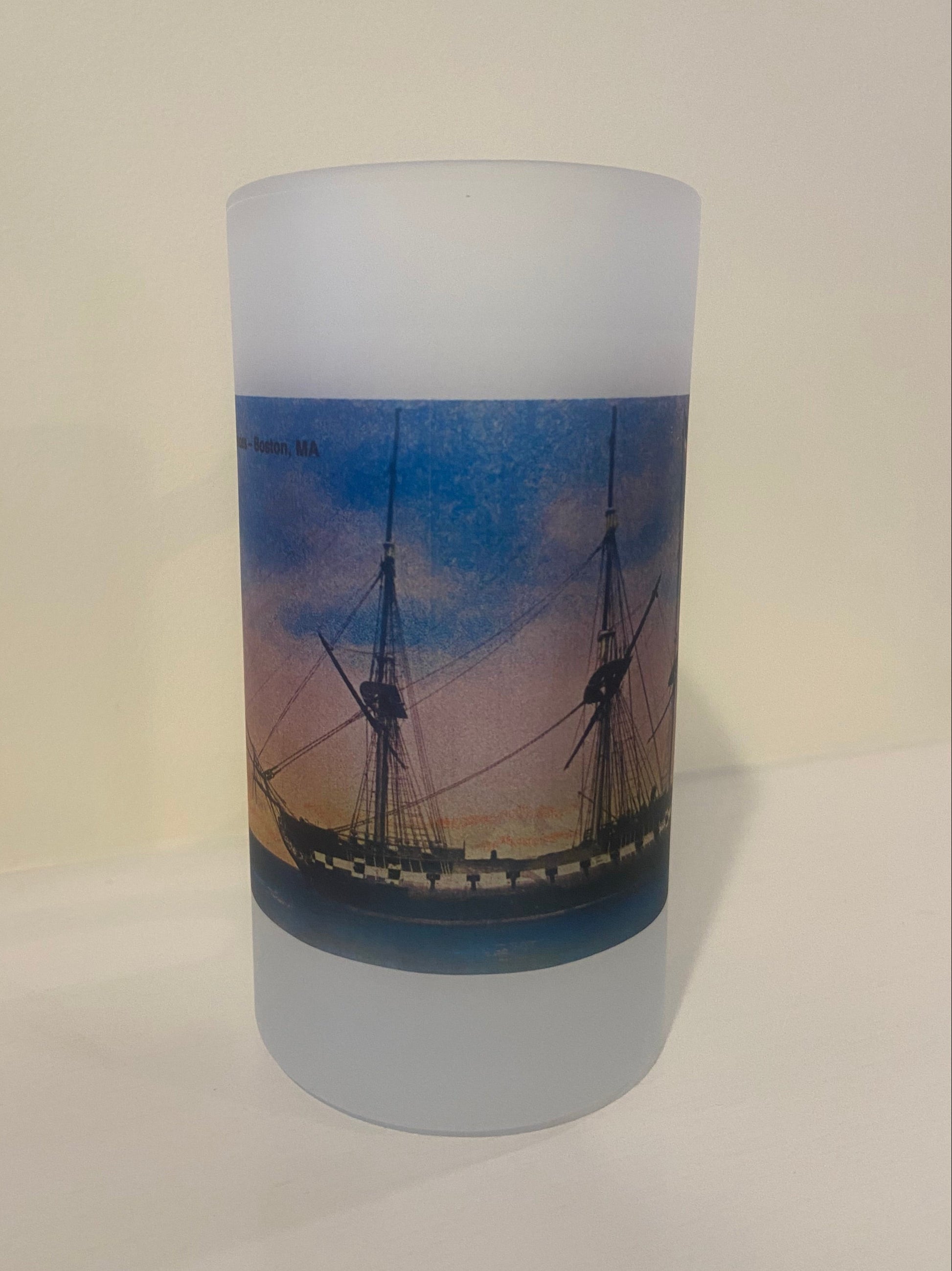 Cylindrical product with a ship image on a white background