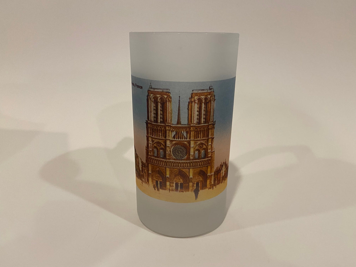Frosted glass tumbler with a design of a famous landmark on a plain background